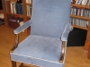 With its new dusty blue velvet cover, this family piece now harmonizes with the client's sunroom