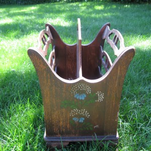 The old magazine rack was a family piece, but worn and water stained
