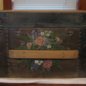 The client wanted an exuberant display of flowers sprayed across this old family trunk