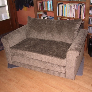 Smooth velvety fabric gives this loveseat a striking new look