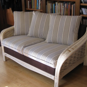 Fun new fabric and repairs to the wicker frame (not shown here) give new life to this lovely loveseat