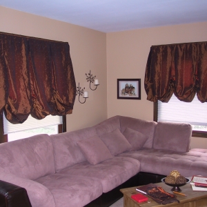 The client wanted simple, draped balloon curtains to soften the look of the room