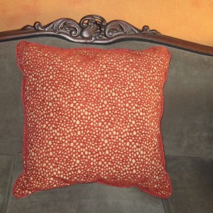 This little pillow matches the stool, thereby pulling the whole room together