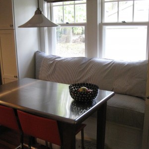 The client was solving several problems here, needing to raise the seating up to a comfortable height, and utilizing the 4 down pillows she already owned