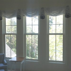 Minimal window treatments show off the beauty of the lake view, while hiding the mini blinds